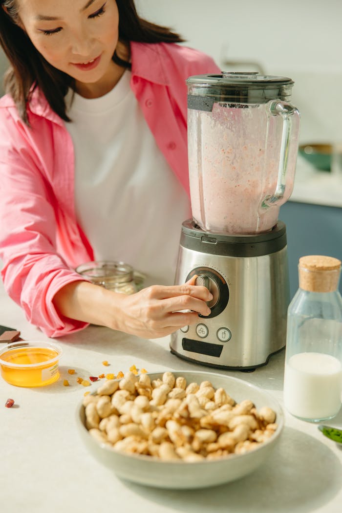 Woman using a Blender